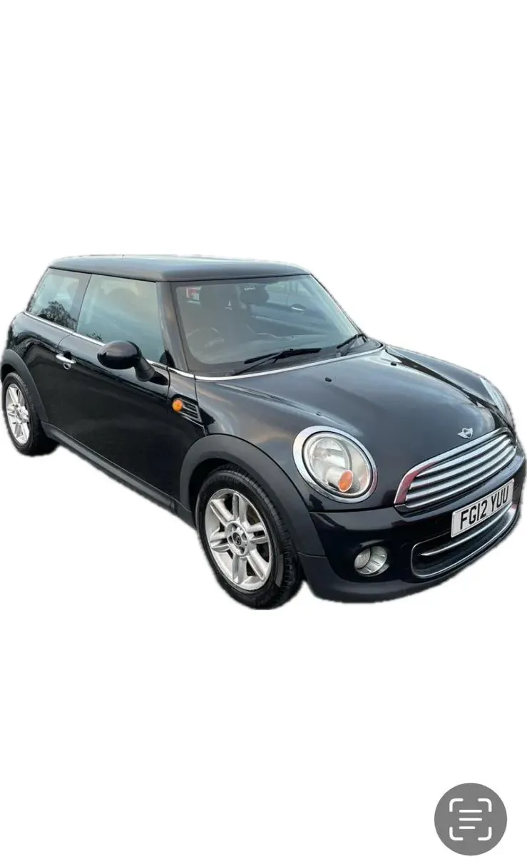 a black minivan parked in front of a white background