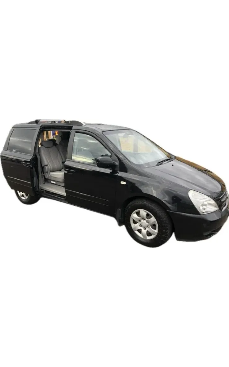 a small black car with its door open