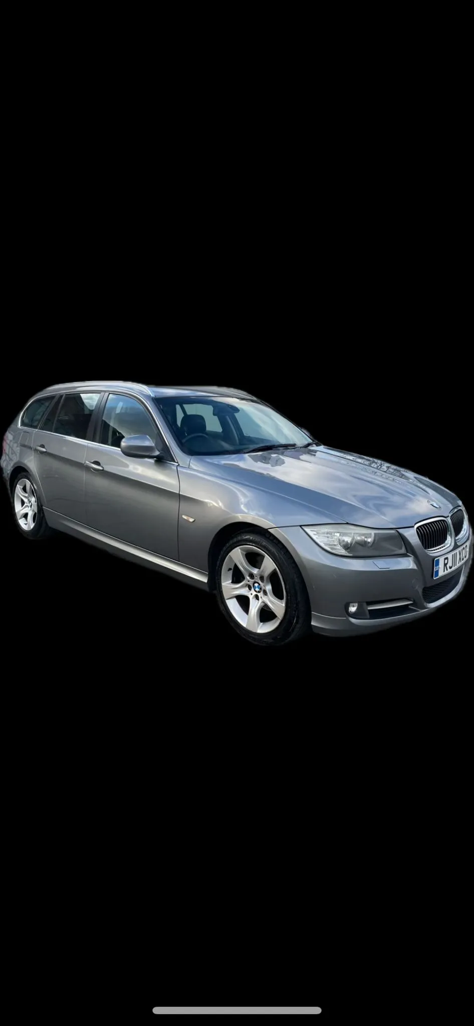 a silver car on a black background