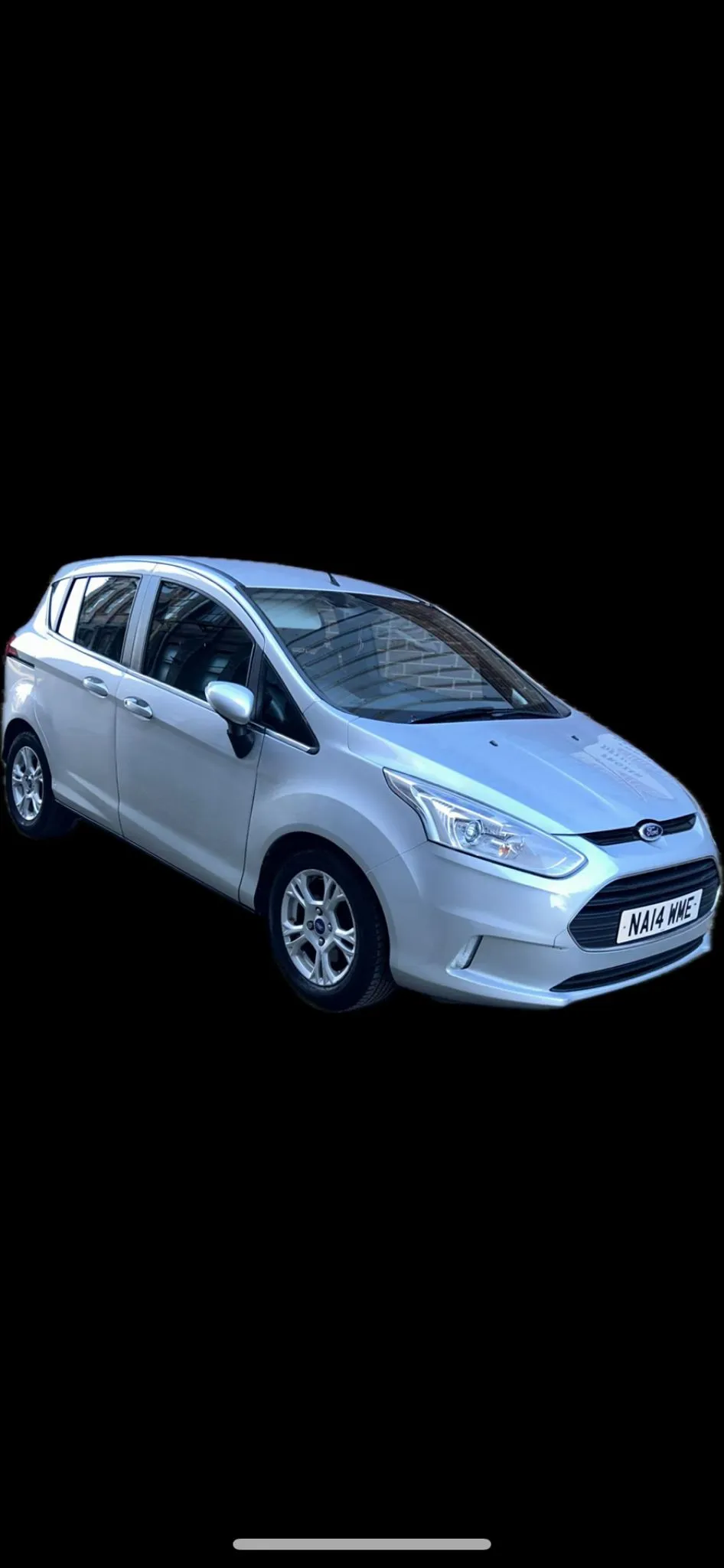 A white car on a black background.